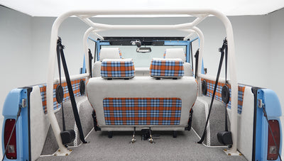 Rear seat and side panels of Classic Ford Bronco featuring blue and orange plaid fabric