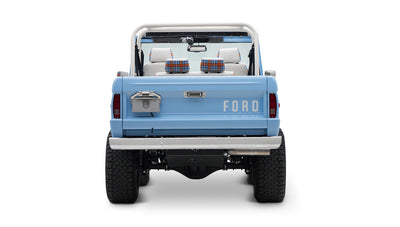 Classic Ford Bronco rear view in light blue with white roll bar and license plate