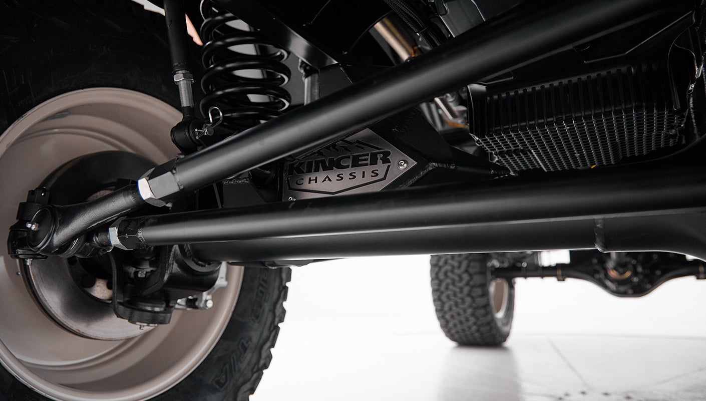 Front suspension and steering components of a Classic Ford Bronco viewed from underneath