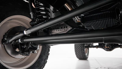 Front suspension and steering components of a Classic Ford Bronco viewed from underneath