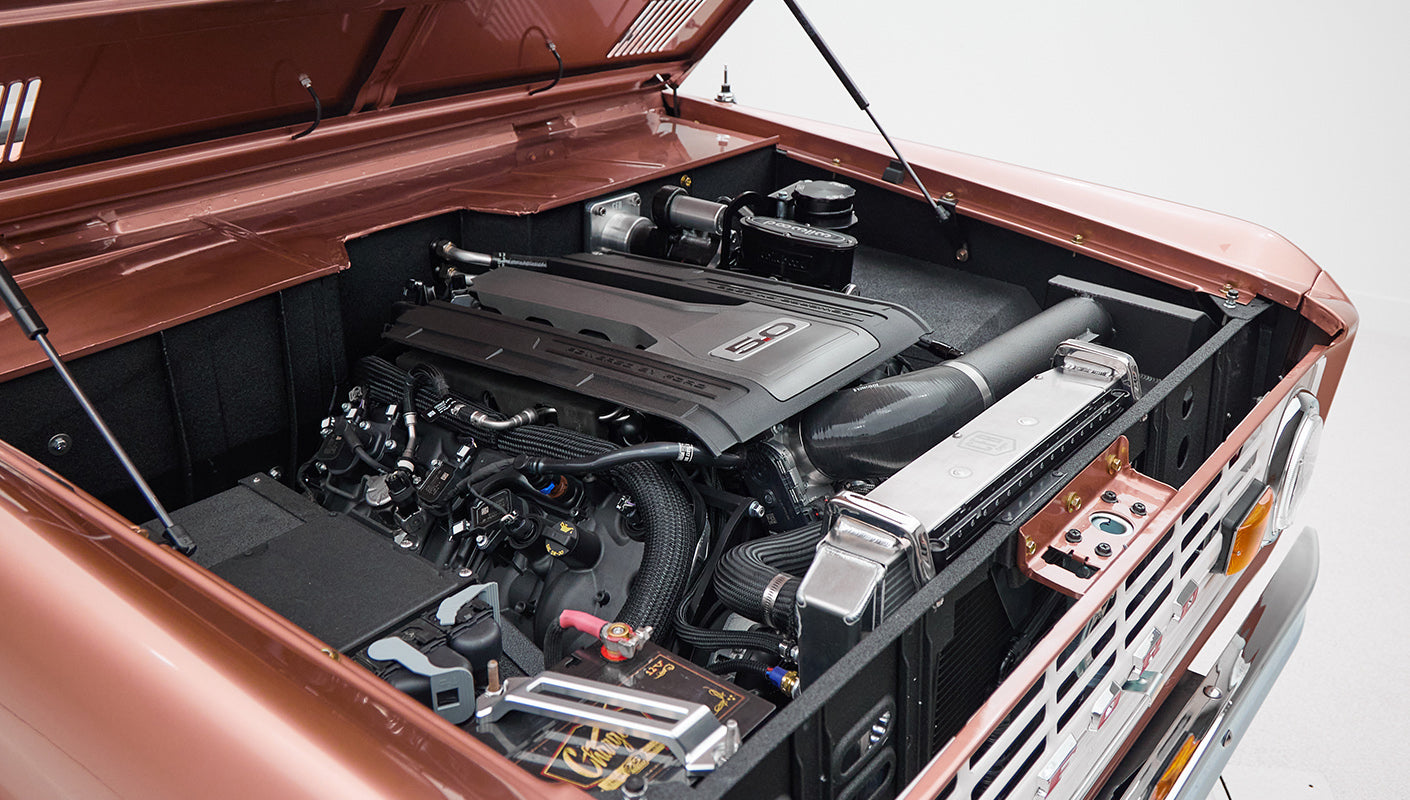 Clean engine compartment with modern 5.0L engine in Classic Ford Bronco