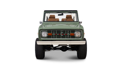 Front view of Classic Ford Bronco in boxwood green with brown seats and white bumper.