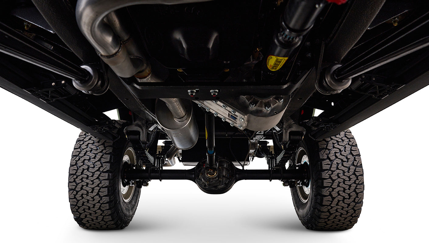 Underneath view of Classic Ford Bronco showing drivetrain and suspension components.