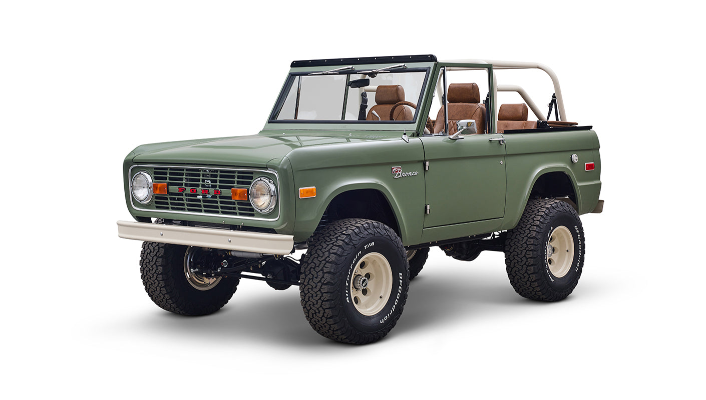 Green Classic Ford Bronco shown from front and side against white background