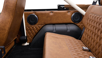 Brown leather upholstery and speakers inside Classic Ford Bronco interior