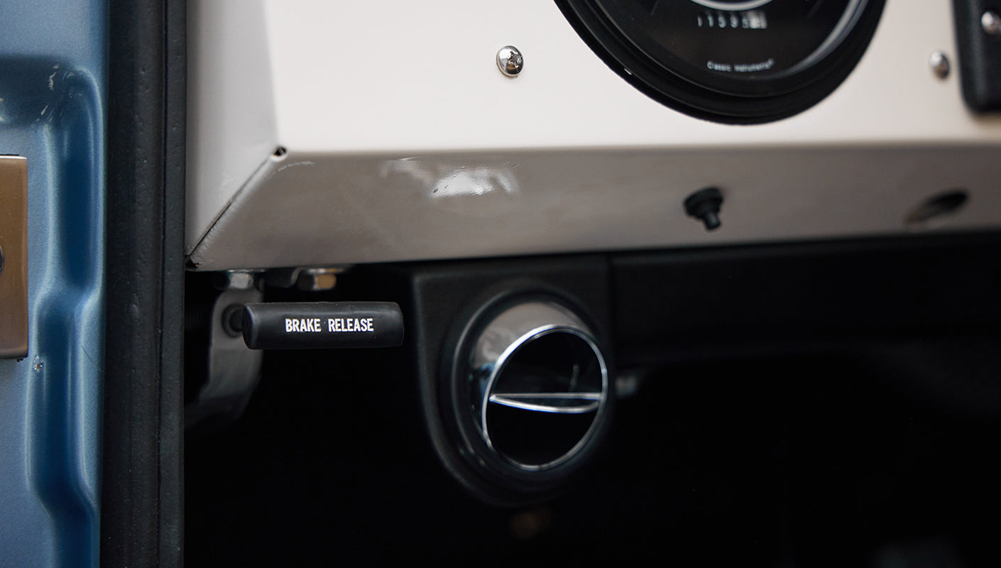 1973 Ford Bronco in Brittany Blue over Whiskey leather vent