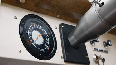 1973 Ford Bronco in Brittany Blue over Whiskey leather gauge