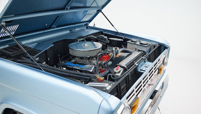 1973 Ford Bronco in Brittany Blue over Whiskey leather engine angle