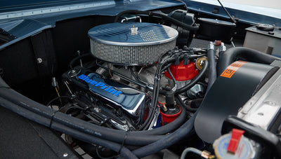 1973 Ford Bronco in Brittany Blue over Whiskey leather engine detail