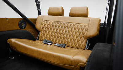1973 Ford Bronco in Brittany Blue over Whiskey leather back seat
