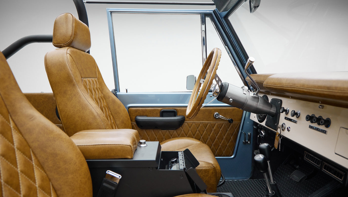 1973 Ford Bronco in Brittany Blue over Whiskey leather interior detail