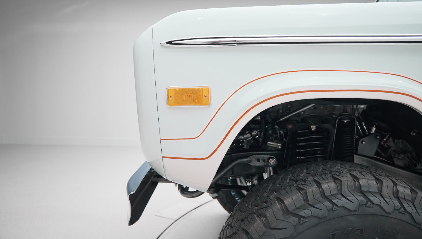 1973 classic ford bronco in diamond blue with butterscotch leather interior, vintage decals and chrome trim front decal