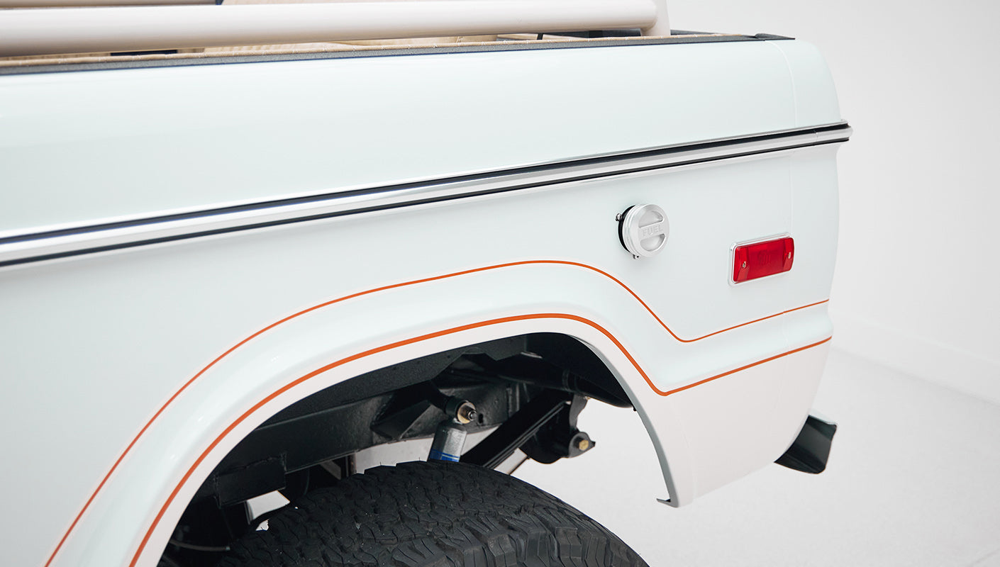 1973 classic ford bronco in diamond blue with butterscotch leather interior, vintage decals and chrome trim rear decal