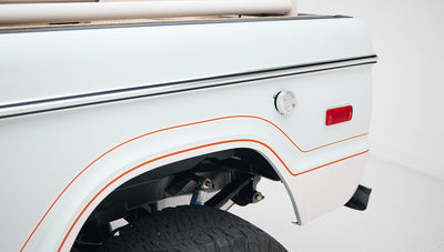 1973 classic ford bronco in diamond blue with butterscotch leather interior, vintage decals and chrome trim rear decal