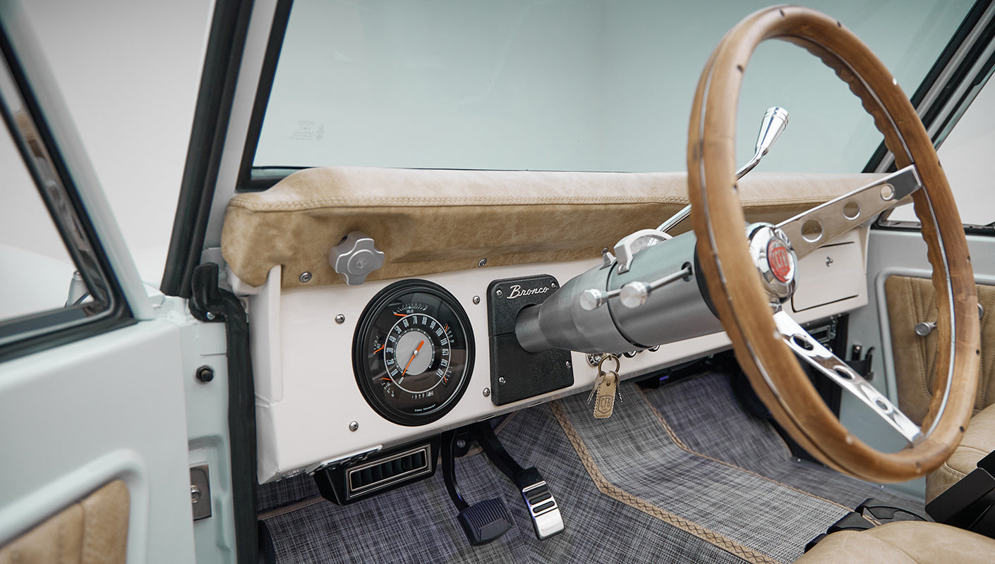 1973 classic ford bronco in diamond blue with butterscotch leather interior, vintage decals and chrome trim dash