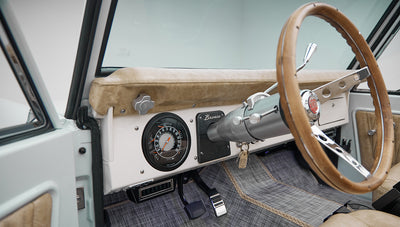 1973 classic ford bronco in diamond blue with butterscotch leather interior, vintage decals and chrome trim dash