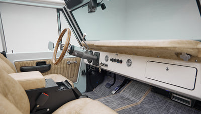 1973 classic ford bronco in diamond blue with butterscotch leather interior, vintage decals and chrome trim passenger dash