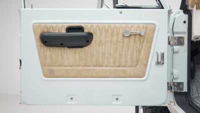 1973 classic ford bronco in diamond blue with butterscotch leather interior, vintage decals and chrome trim door panel