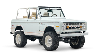1973 classic ford bronco in diamond blue with butterscotch leather interior, vintage decals and chrome trim front passenger