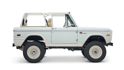 1973 classic ford bronco in diamond blue with butterscotch leather interior, vintage decals and chrome trim passenger profile