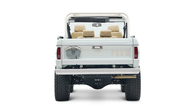 1973 classic ford bronco in diamond blue with butterscotch leather interior, vintage decals and chrome trim rear profile