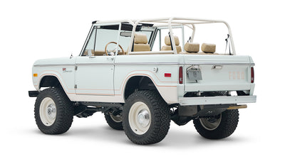 1973 classic ford bronco in diamond blue with butterscotch leather interior, vintage decals and chrome trim rear driver