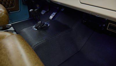 Leather seats with floor pedals and gear levers inside Classic Ford Bronco
