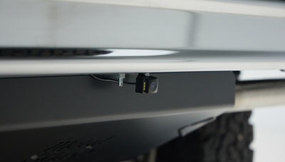 Mounted backup camera under rear bumper of Classic Ford Bronco