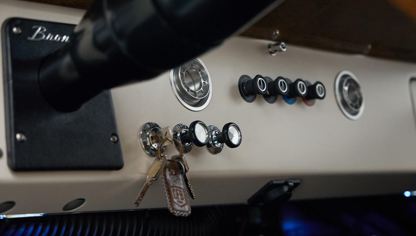 Dashboard section with key fob, switches, and air vents inside Classic Ford Bronco