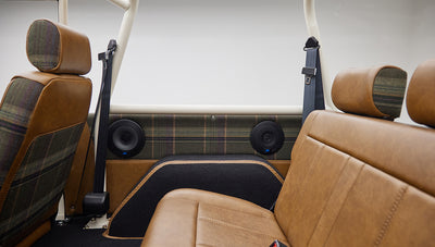 Interior rear seats and dual black speakers installed in Classic Ford Bronco