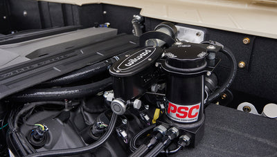 Underbody view showing differential, exhaust, and suspension of lifted Classic Ford Bronco
