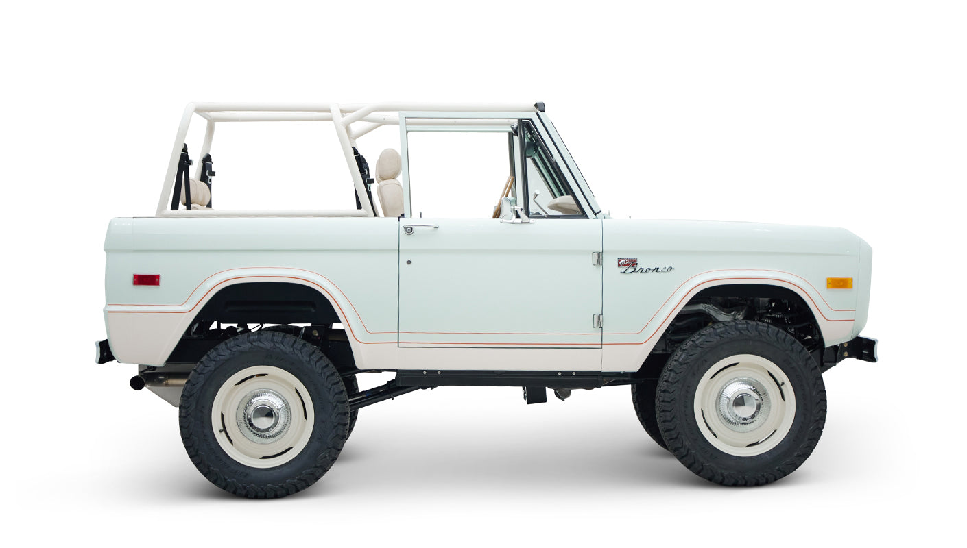 Side profile of white Classic Ford Bronco 1974 Diamondblue Coyote Series