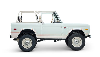 Side profile of white Classic Ford Bronco 1974 Diamondblue Coyote Series