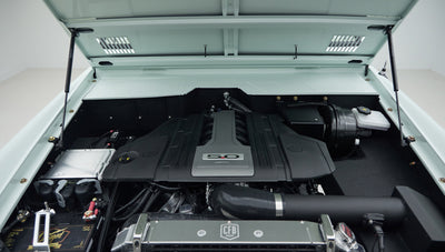 View of a Classic Ford Bronco engine bay with prominent 5.0 badge on engine cover