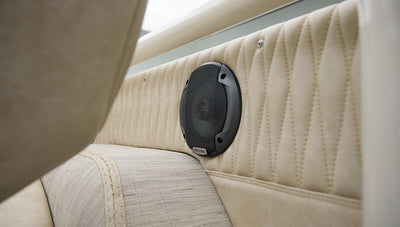 Beige quilted rear interior panel with black speaker of Classic Ford Bronco