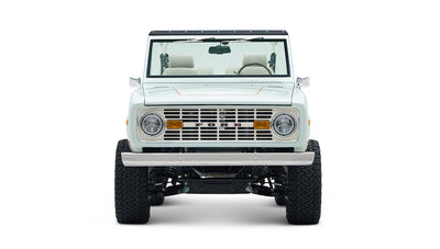 Front view of white Classic Ford Bronco 1974 Diamondblue Coyote Series with classic grille and bumper