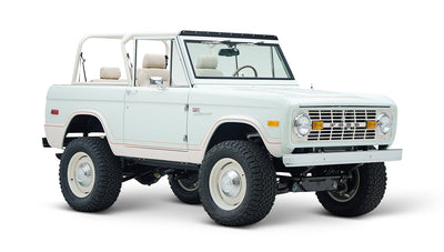 Side view of white Classic Ford Bronco 1974 Diamondblue Coyote Series with no roof
