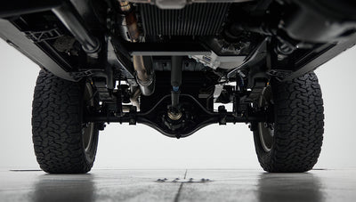 View of rear axle and differential under Classic Ford Bronco with tires