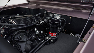 Close detail of engine components, including Wilwood and PSC parts inside Classic Ford Bronco