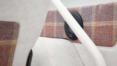 Close-up of speaker mounted on plaid panel inside a Classic Ford Bronco