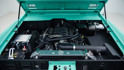 Engine bay with detailed view of engine, radiator, and other components in Classic Ford Bronco