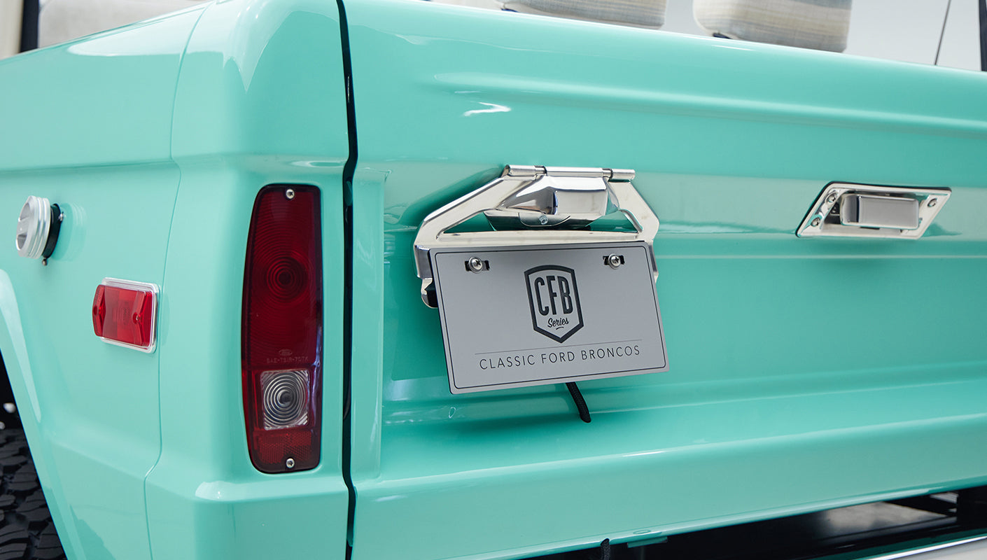 Rear section of mint green Classic Ford Bronco with taillight and Classic Ford Broncos license plate