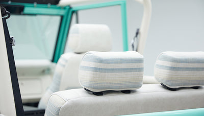 Close-up of white and light blue striped headrest on a Classic Ford Bronco seat