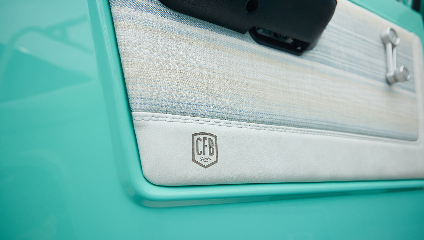 Door interior panel of Classic Ford Bronco with light fabric and CFB Series logo