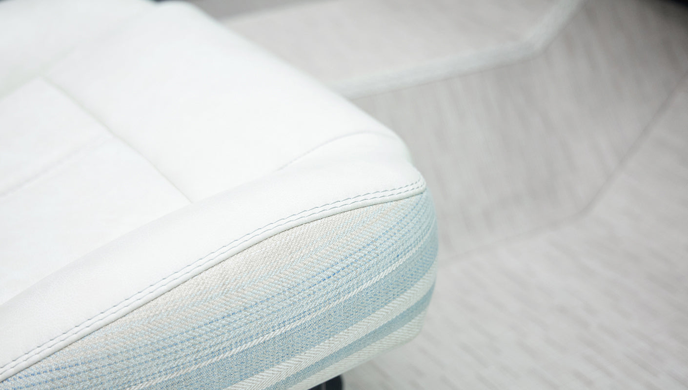 Close-up of white and light blue patterned seat upholstery in classic Ford Bronco