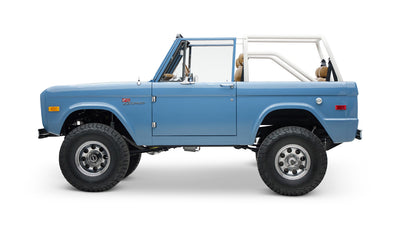 1974 classic ford bronco in stars & stripes blue with whiskey leather driver profile