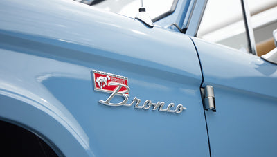 1974 classic ford bronco in stars & stripes blue with whiskey leather bronco emblem