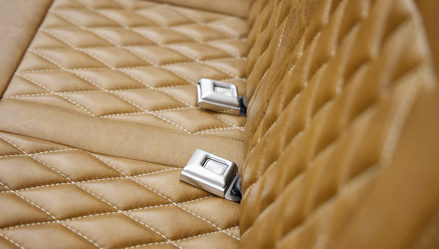 1974 classic ford bronco in stars & stripes blue with whiskey leather seat buckles