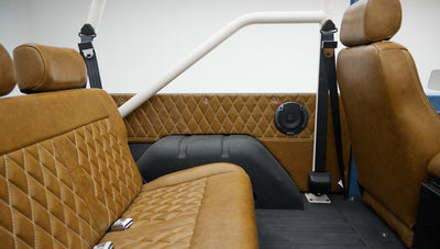 1974 classic ford bronco in stars & stripes blue with whiskey leather rear panel