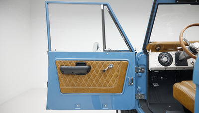 1974 classic ford bronco in stars & stripes blue with whiskey leather door panel